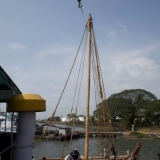 013   The main mast is lowered back in