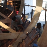 065   Sawing the lower faying edge of plank to get an exact fit