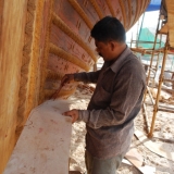 079   Head shipwright shaping the cheek piece (1)