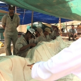 051   HE Abd al-Aziz sees the sewing process first hand