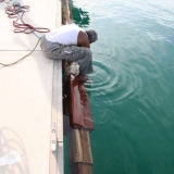 113   The mast is tied up to await fitting