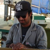 043   Ayaz Al Zadjali sewing sails.