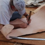 046   Tom Vosmer cuts leather for the quarter rudders