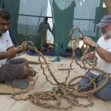 077   Master Rigger Hussain works with Tom Vosmer on the ship's rigging.