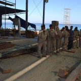 029   It takes team work to unload the teak
