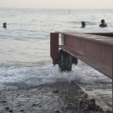 080   The front wheels of the frame are in the sea now