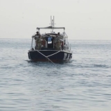 115   The tow guns its engines hard