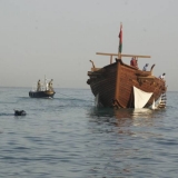 123   The tow boat prepares to take the Jewel of Muscat to her new berth
