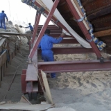 037   The sand has been cleared from under the ship