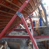 012   Side supports are added to hold the ship steady