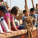 081   The children watch the stores being loaded