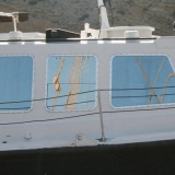 085   The Jewel's rigging reflected in her tow boat.