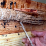 014   Sewing rope between the planks