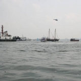 158   A flotilla welcomes Jewel into port