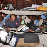 047   Ahmed Al Baluchi reads while off watch