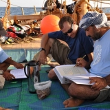 099   Captain Saleh, Eric Staples and Adam Al Baluchi study 15th century Arab navigational texts