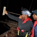 057   Captain Saleh using a traditional Kamal