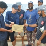 154   Singaporean Jeff Khoo receives a certificate from Captain Saleh.