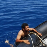137   Fahad Al Shaibi climbs onto the inflatable after a refreshing swim