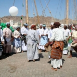 019   Traditional folk dancers celebrate the departure