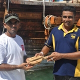 061   Captain Saleh presents an engraved block to Lt. Amila Abeywickrama of the Sri Lankan Navy
