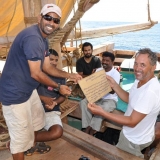046   Geoffrey Dobbs receives a crew member's certificate from Captain Saleh