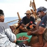 009   Adam Al Baluchi, Hussein Al Raisi, and Captain Saleh help prepare dinner