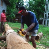 105   Tuanie Ismail works on the main mast.