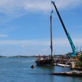 119   It takes a tall crane to lift a 17-metre mast