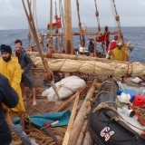 025   With sails down, the crew waits out the storm