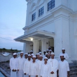 116   Captain Saleh, Said Al Tarshi, and Ahmed Al Balushi with Koranic school students