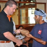 094   Bruno Cristal, Manager of the Golden Sands Resort, accepts Captain Saleh's thanks for his generous support of the Jewel
