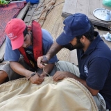 027   Sajid Valappil and Ayaz Al Zadjali repair the mizzen sail