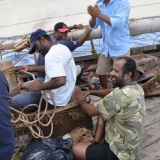 032   Ahmed, Yahya, Said and Hussein add some musical fun to morning chores