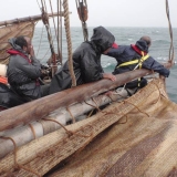 007   Lowering the palm leaf matting sails