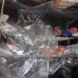 012   Plastic sheeting helps the crew stay dry while sleeping