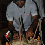 093   Captain Saleh tucks in to the Portside of his birthday cake