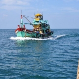 031   A local fishing boat makes a close pass