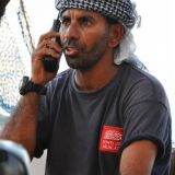 032   Captain Saleh Al Jabri talks with his family via the satellite phone