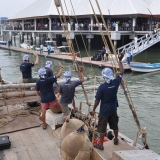 042   The crew waves to the welcoming crowd on shore