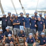 088   A happy crew during the passage through Singapore harbour