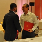 101   Secretary General Sayyid Badr and Foreign Minister George Yeo shake hands, completing the handover of Jewel