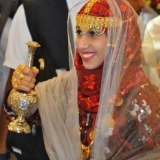 132   A traditional Omani welcome complete with garlands of flowers