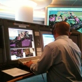 036   A controller at Singapore's Port Control Centre helps guide Jewel in to harbour