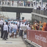 066   The dancers lead the crew ashore