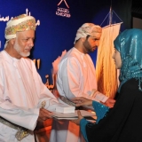 153   The representative of Oman LNG receives a certificate of appreciation for their support of the project.