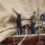 087   Working on the Jewel's palm leaf mat sails
