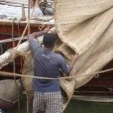092   Working on the Jewel's palm leaf mat sails