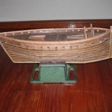 147   Model of the Jewel of Muscat under construction. Mast now being stepped, rigging commenced and sails underway. By Den Smith